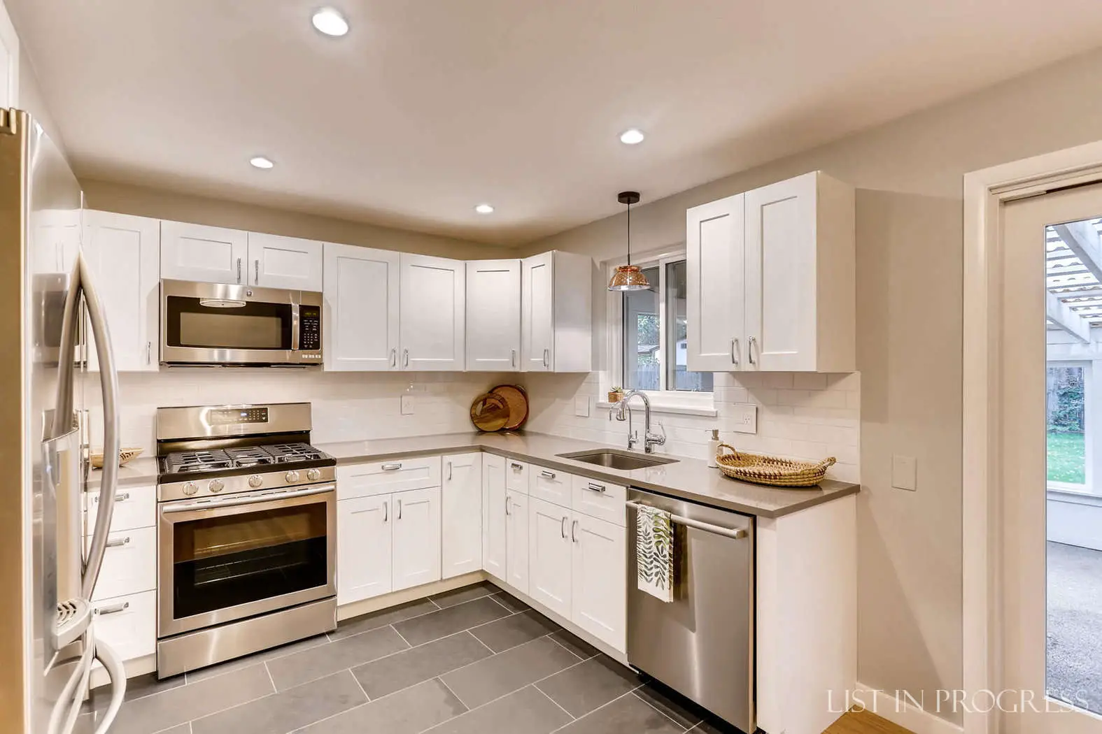 white shaker kitchen cabinets with gray silestone quartz countertop