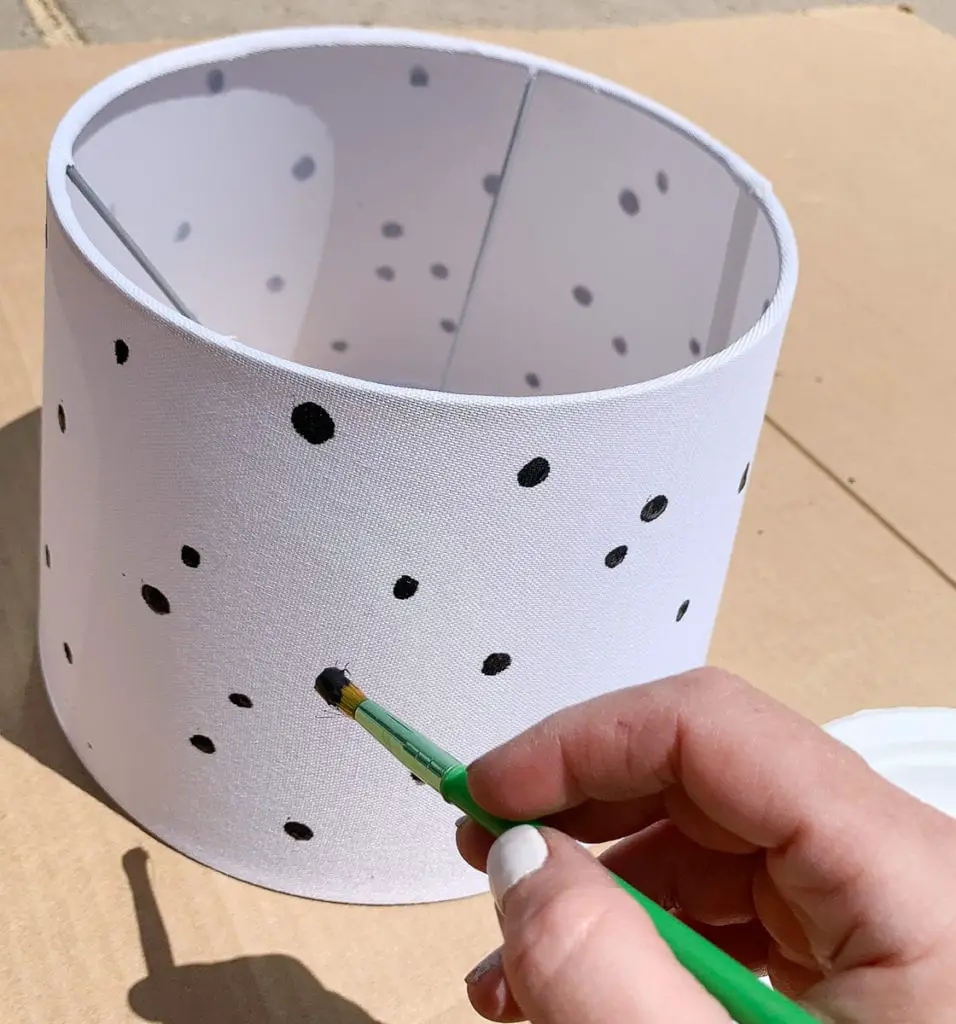 painting black spots on upcycled diy craft projects lampshades