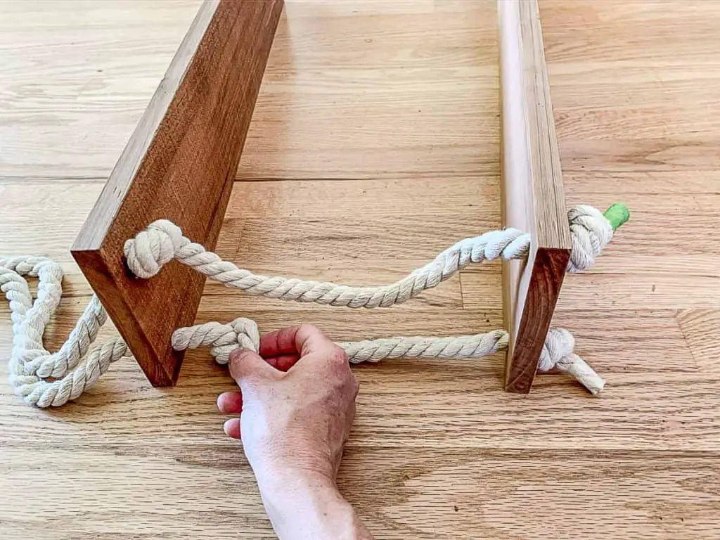 adjust knots on hanging rope shelves 