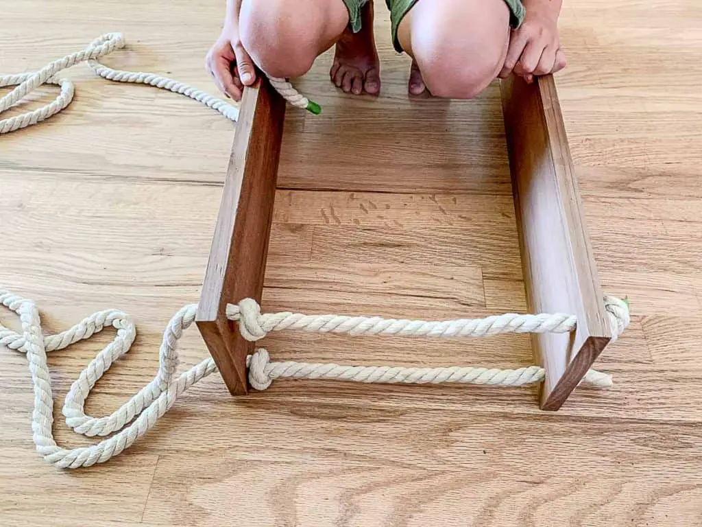 adjust knots on hanging rope shelves 