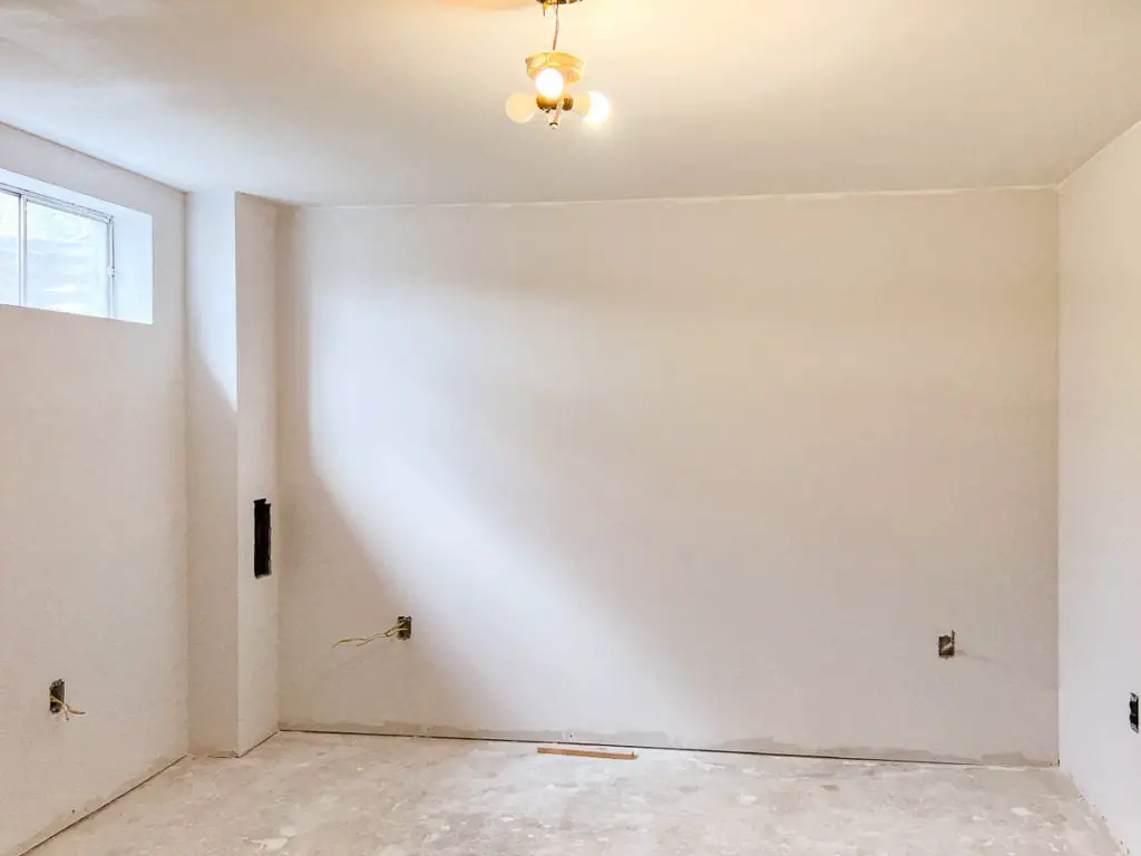 basement bedroom with ceiling painted 